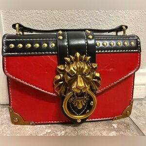 Stylish Lion Red and Black Women's Bag with Gold Accents